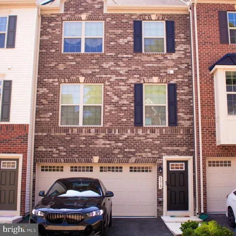 a car parked in front of a brick building