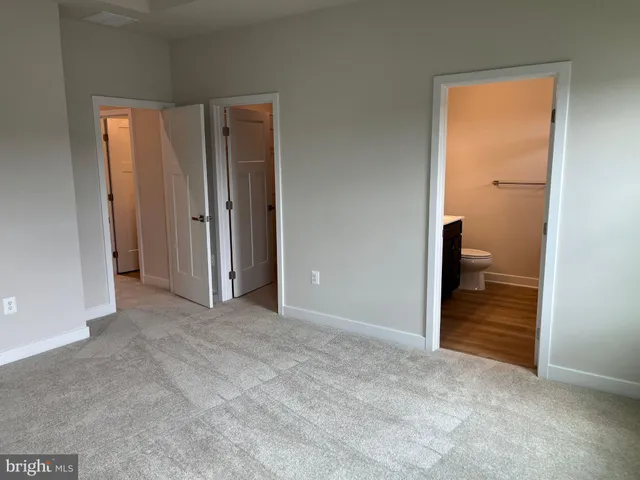 an empty room that has a bathroom