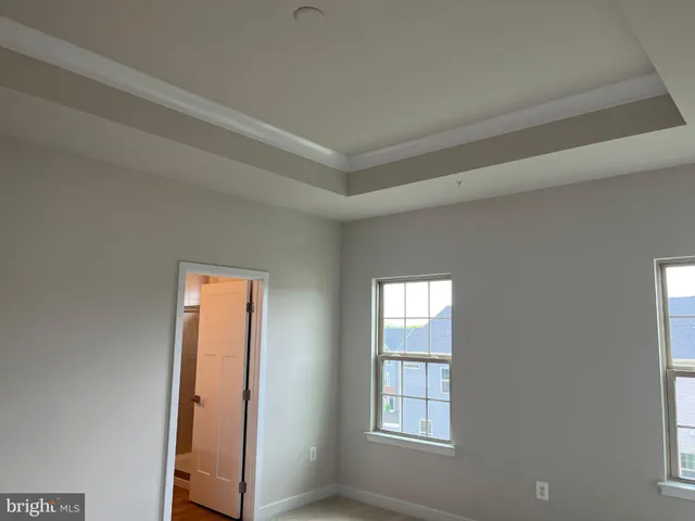 a view of empty room with windows