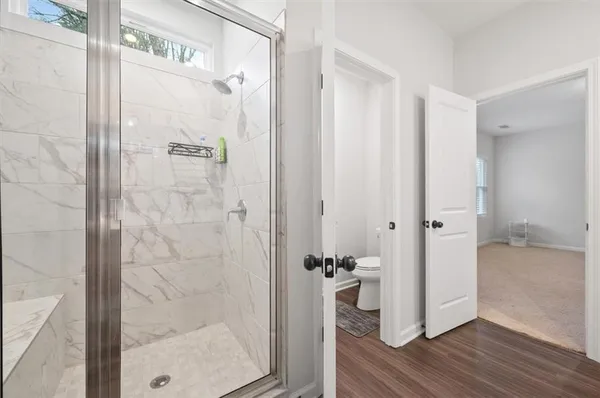 a bathroom with a glass shower door