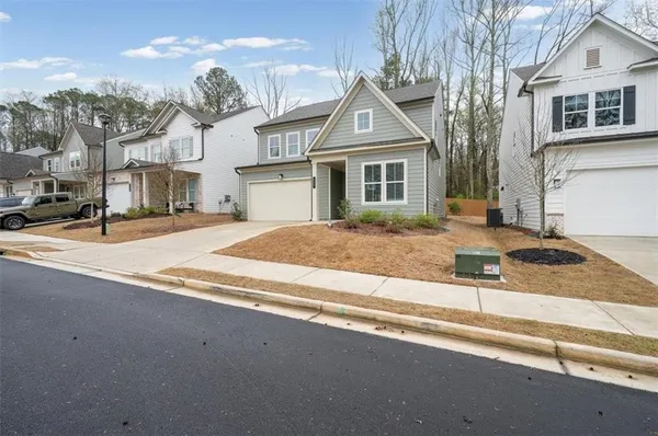 a front view of a house with a yard