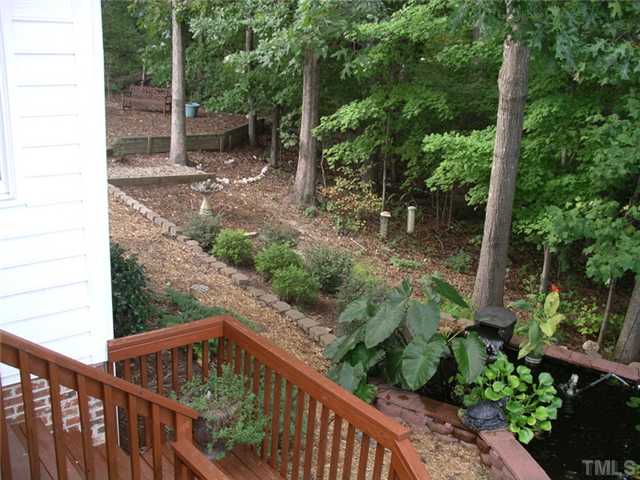 5306 Fiddlewood Court Raleigh, NC 27613 - Photo 11 of 14 Lush backyard that is nicely landscaped and ready for a tranquil reading area or the roar of kids and a playset!