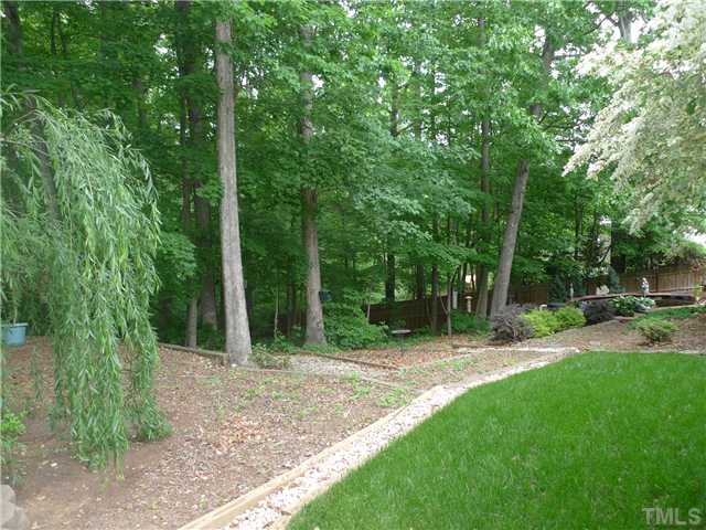 5306 Fiddlewood Court Raleigh, NC 27613 - Photo 13 of 14 One of many paths around the backyard