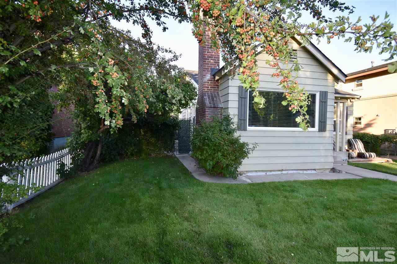 1046 Watt Street Reno, NV 89509 - Photo 4 of 25 a view of a house with a yard and tree s