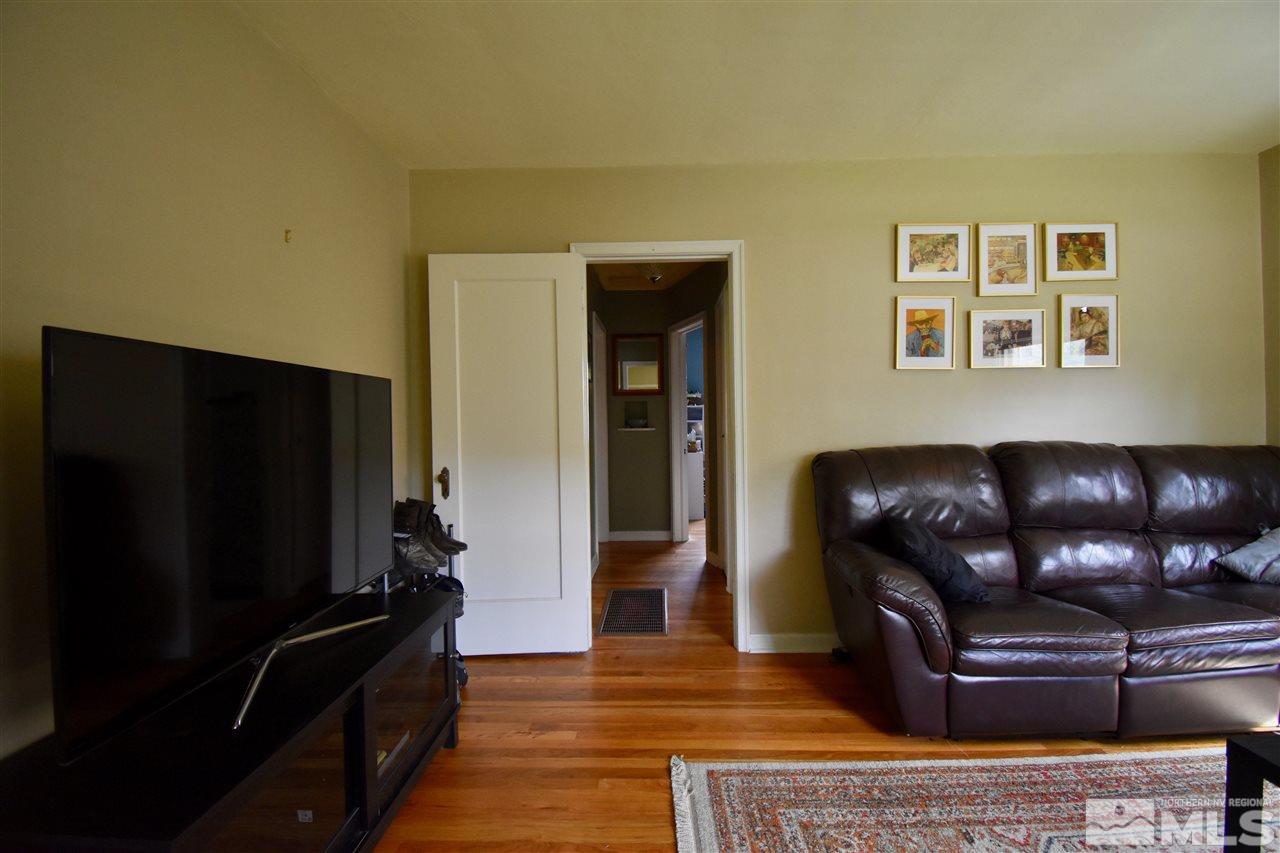 1046 Watt Street Reno, NV 89509 - Photo 5 of 25 a living room with furniture and a flat screen tv