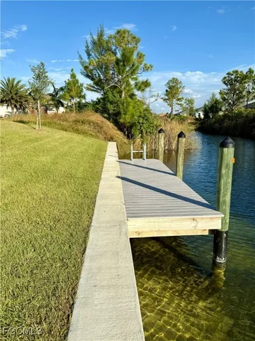 a view of swimming pool with seating space