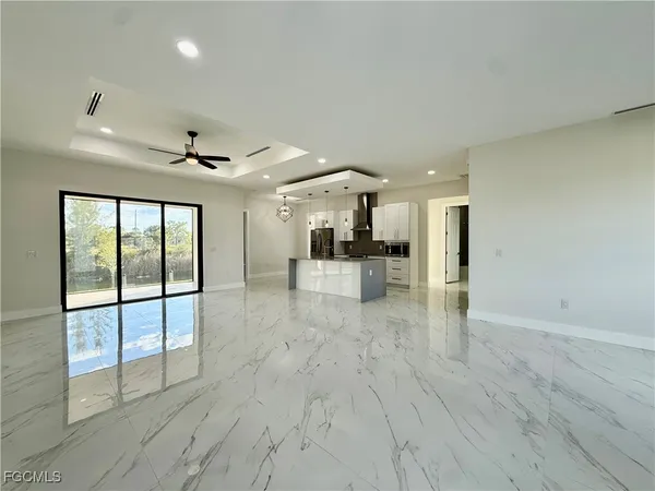 a view of a livingroom with a furniture wooden floor and window