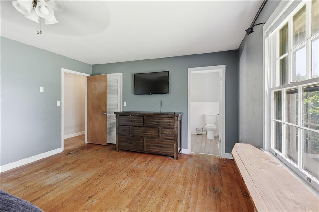 570 Wildcat Bridge Road Royston, GA 30662 - Photo 15 of 29 a bedroom with a bed and flat screen tv