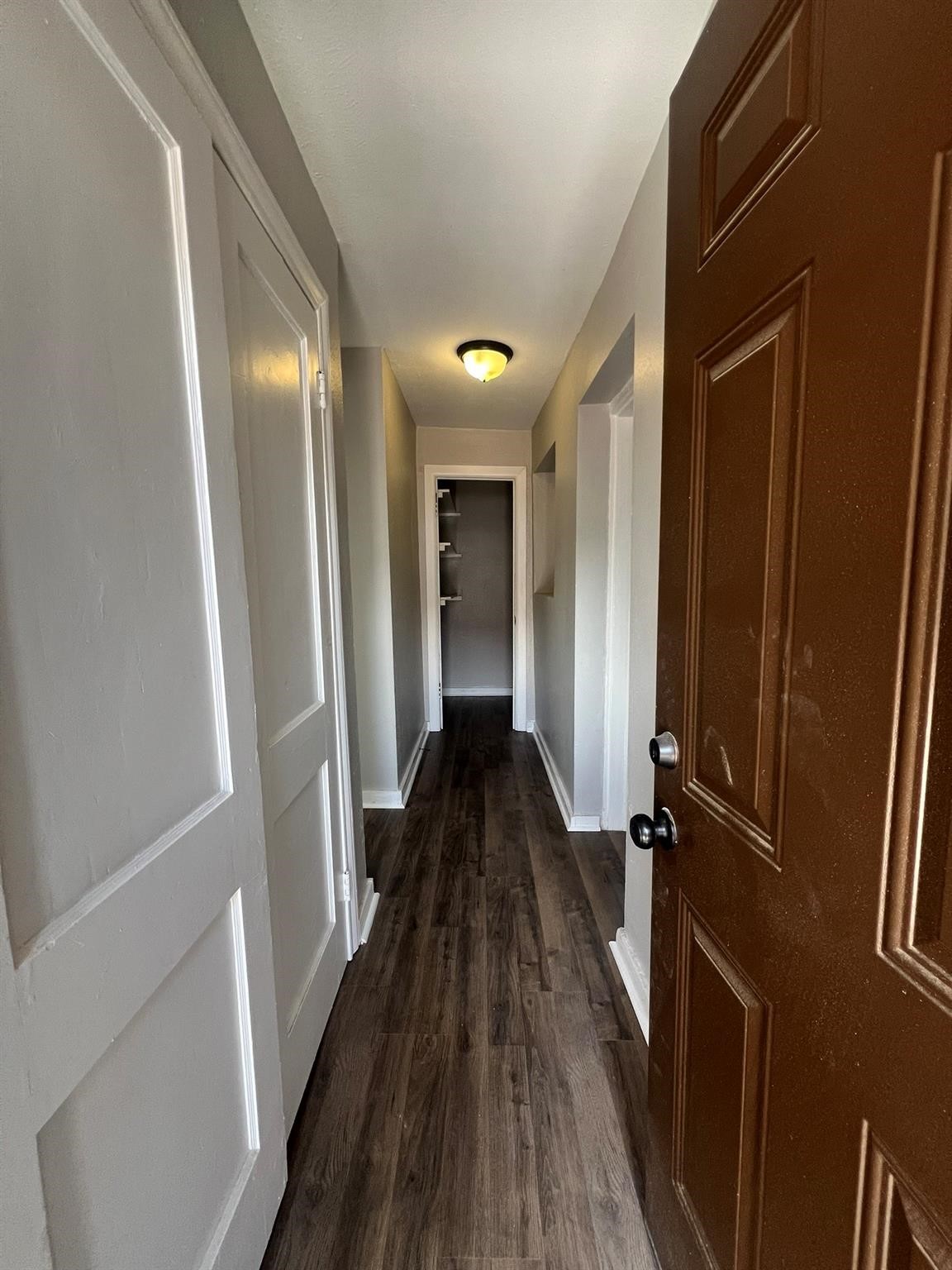 2531 Stevens Street Houston, TX 77026 - Photo 21 of 39 a view of a hallway with wooden floor and staircase