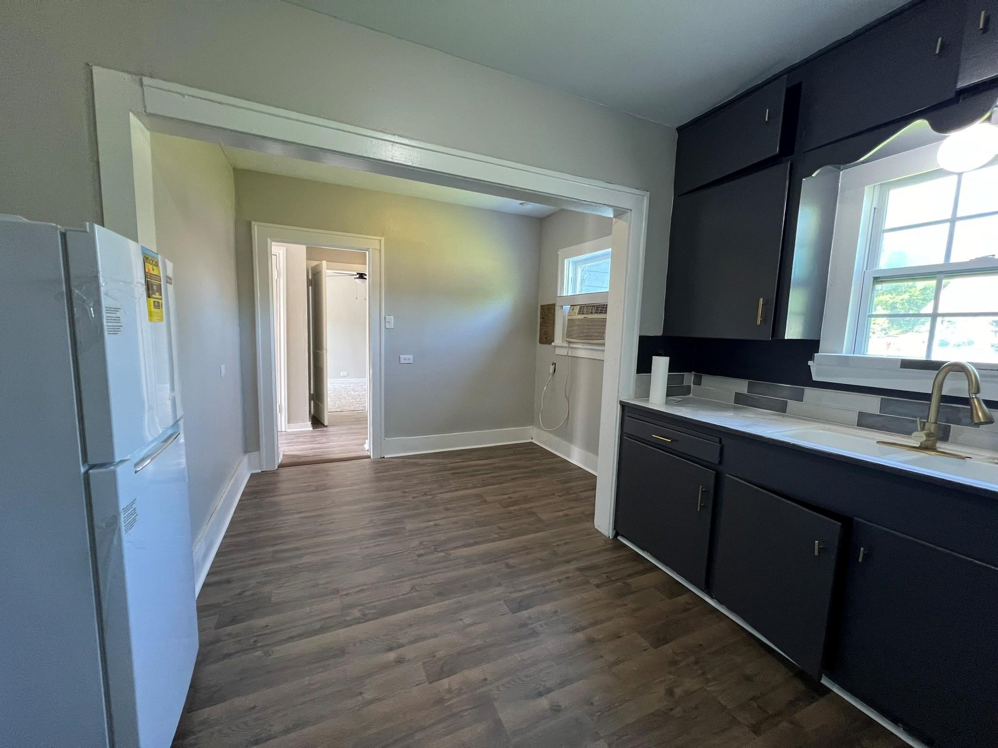 2531 Stevens Street Houston, TX 77026 - Photo 25 of 39 a kitchen with sink and refrigerator