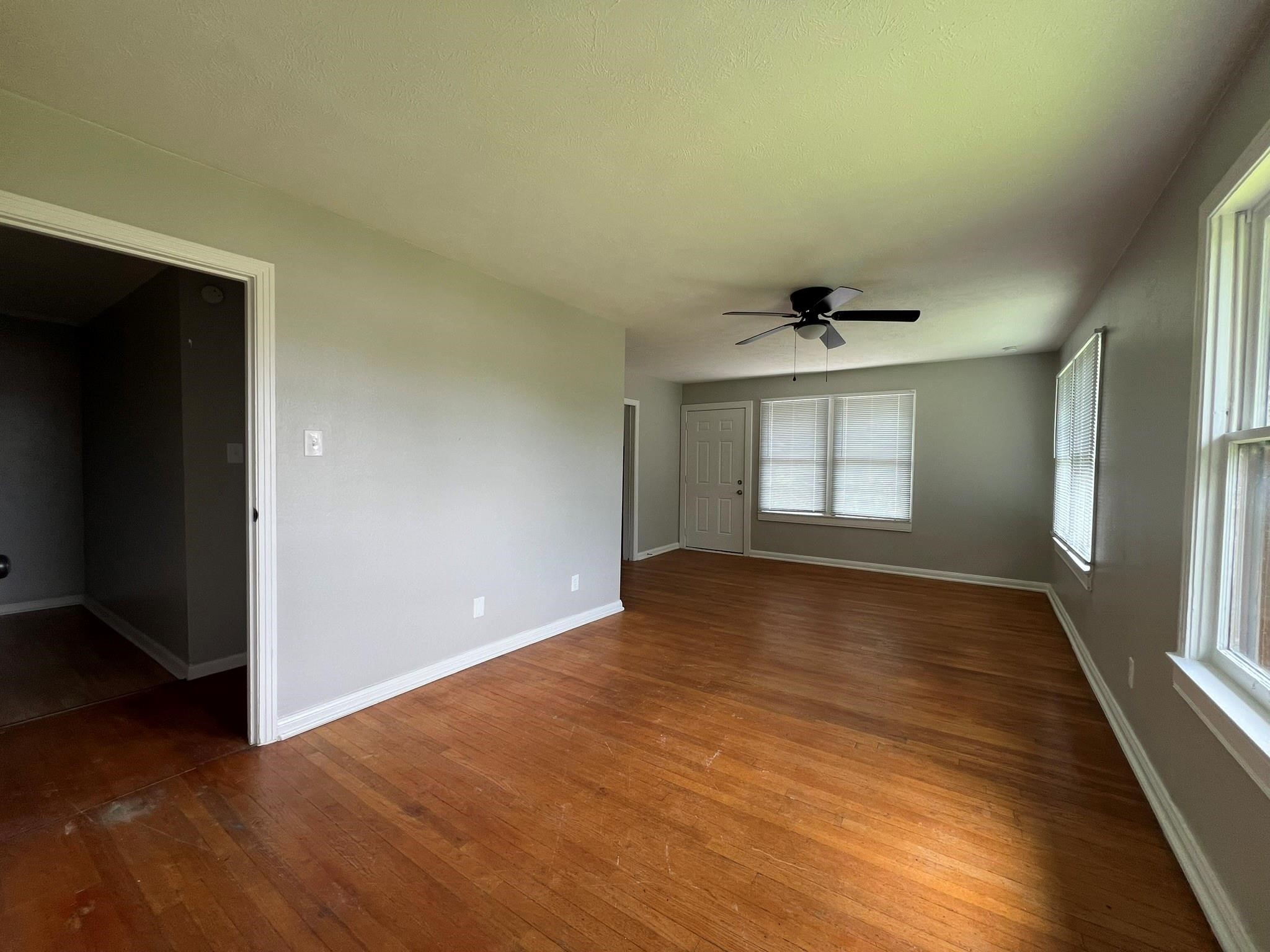 2531 Stevens Street Houston, TX 77026 - Photo 30 of 39 a view of an empty room with wooden floor and a window
