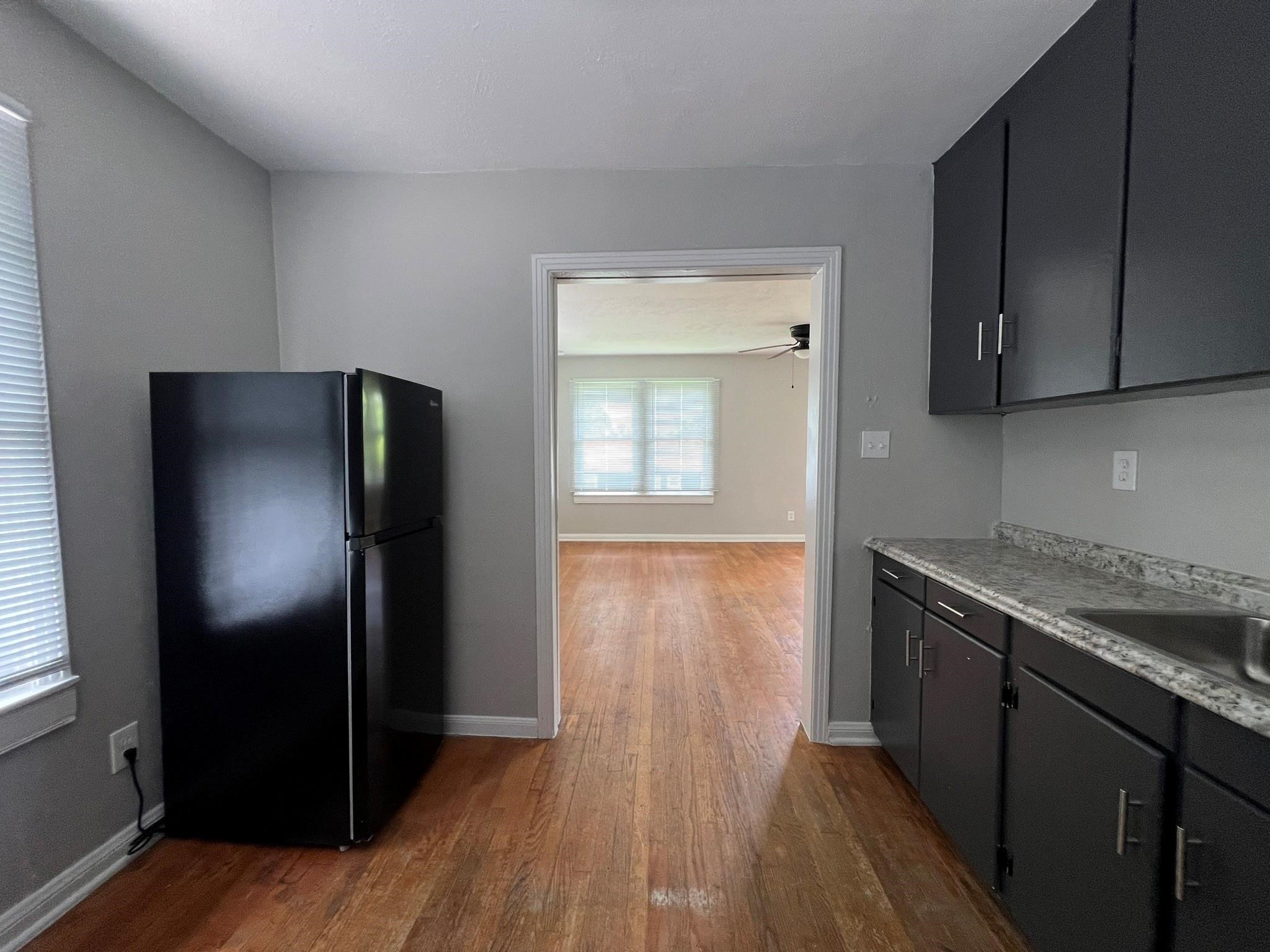 2531 Stevens Street Houston, TX 77026 - Photo 32 of 39 a kitchen with a refrigerator and a sink