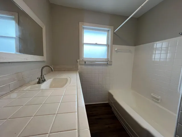 a bathroom with a sink and a bathtub