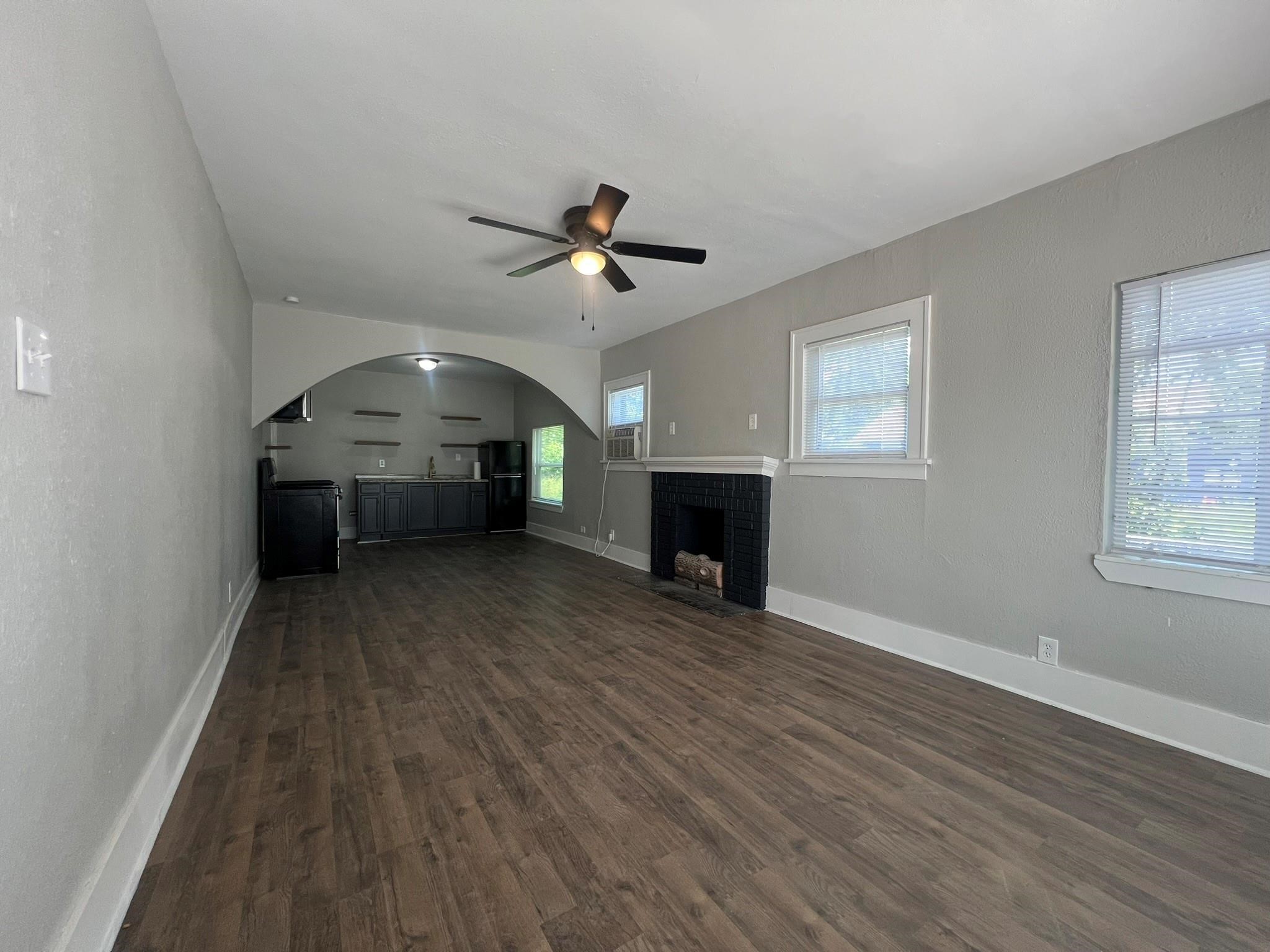 2531 Stevens Street Houston, TX 77026 - Photo 7 of 39 wooden floor in an empty room with a window