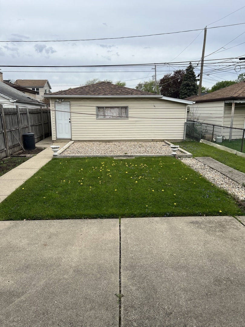 7416 West Addison Street Chicago, IL 60634 - Photo 18 of 19 a front view of a house with a yard