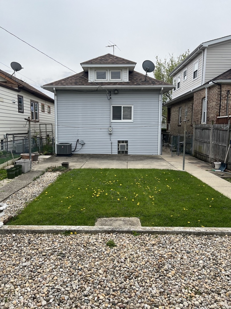 7416 West Addison Street Chicago, IL 60634 - Photo 19 of 19 a backyard of a house with lots of green space