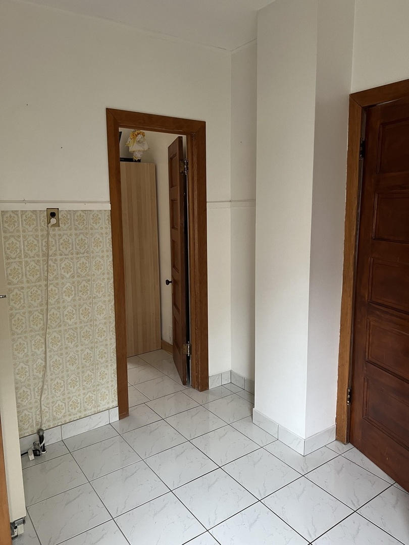 7416 West Addison Street Chicago, IL 60634 - Photo 7 of 19 a view of a bathroom with mirror