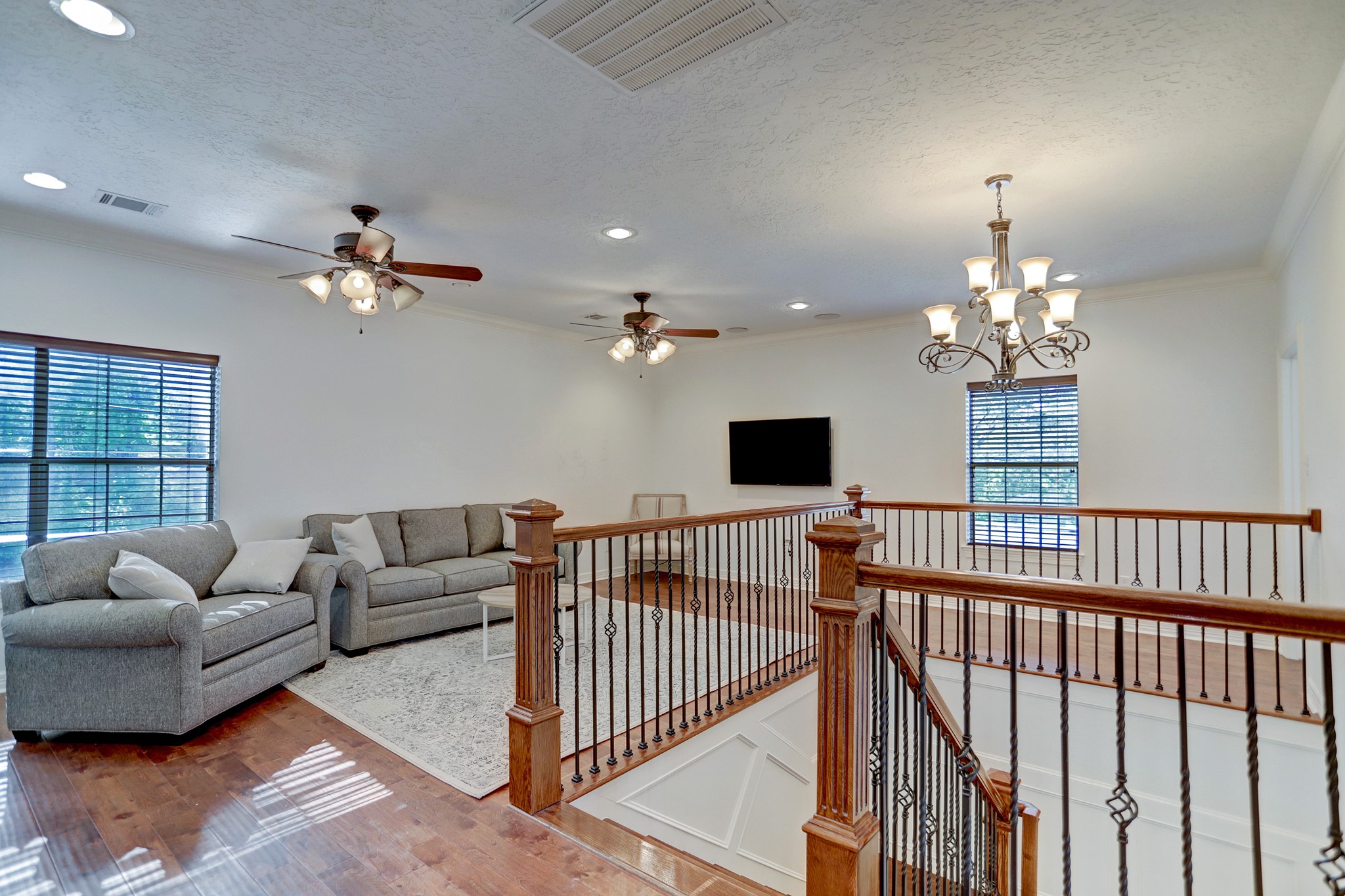 14362 Calvary Road Willis, TX 77318 - Photo 12 of 44 a living room with furniture a chandelier and a window