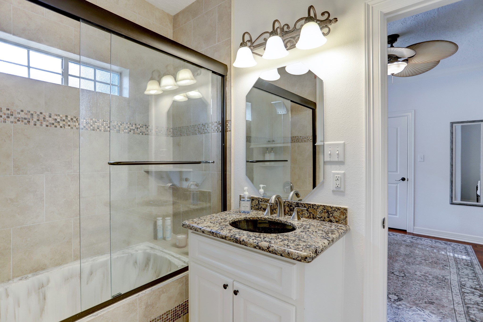 14362 Calvary Road Willis, TX 77318 - Photo 16 of 44 a bathroom with a sink and a mirror