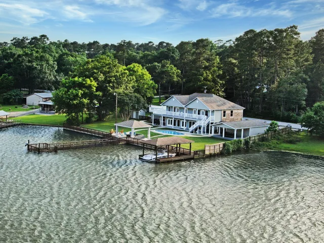 an aerial view of a garden with swimming pool