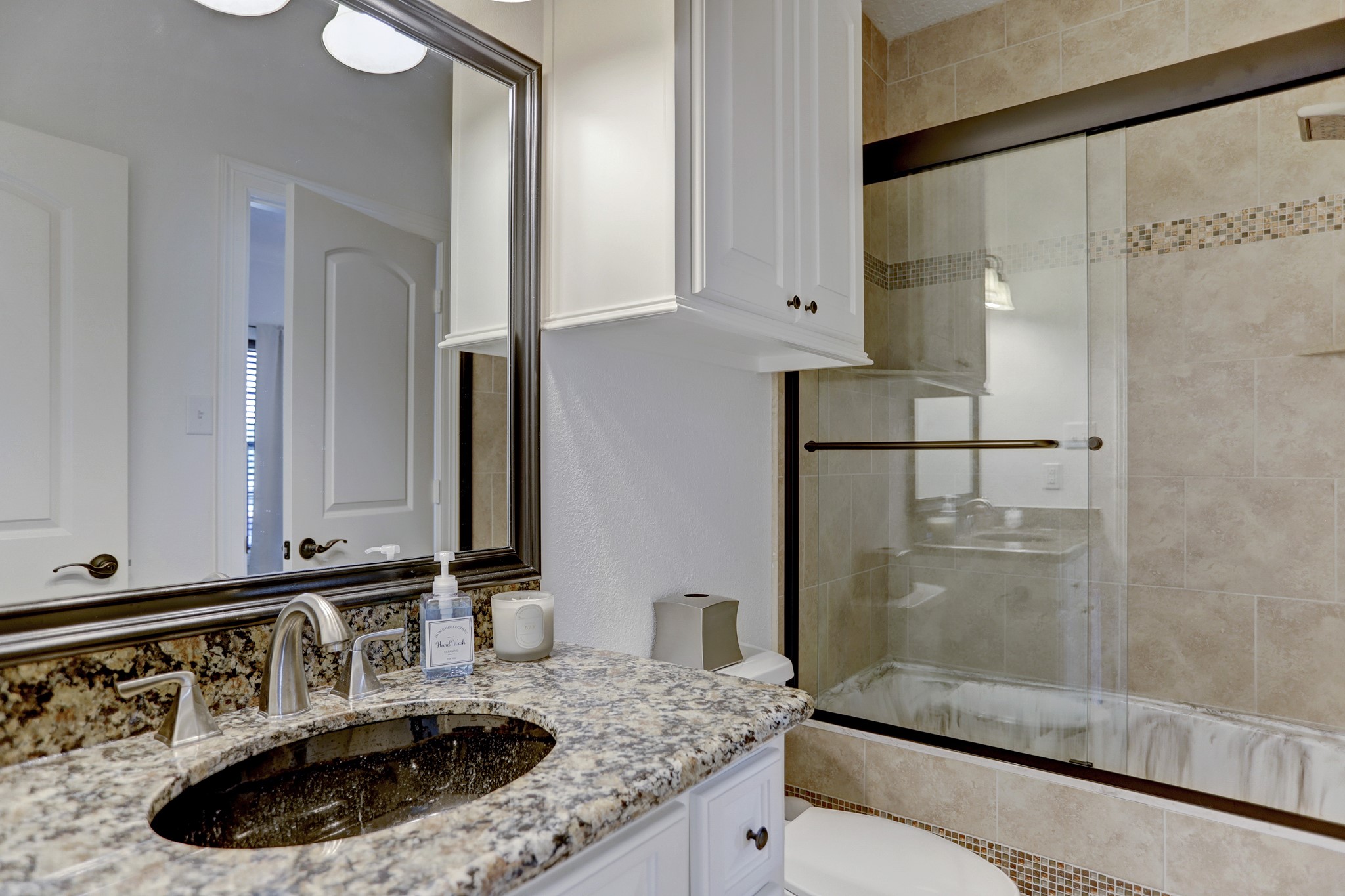 14362 Calvary Road Willis, TX 77318 - Photo 21 of 44 a bathroom with a sink and a mirror