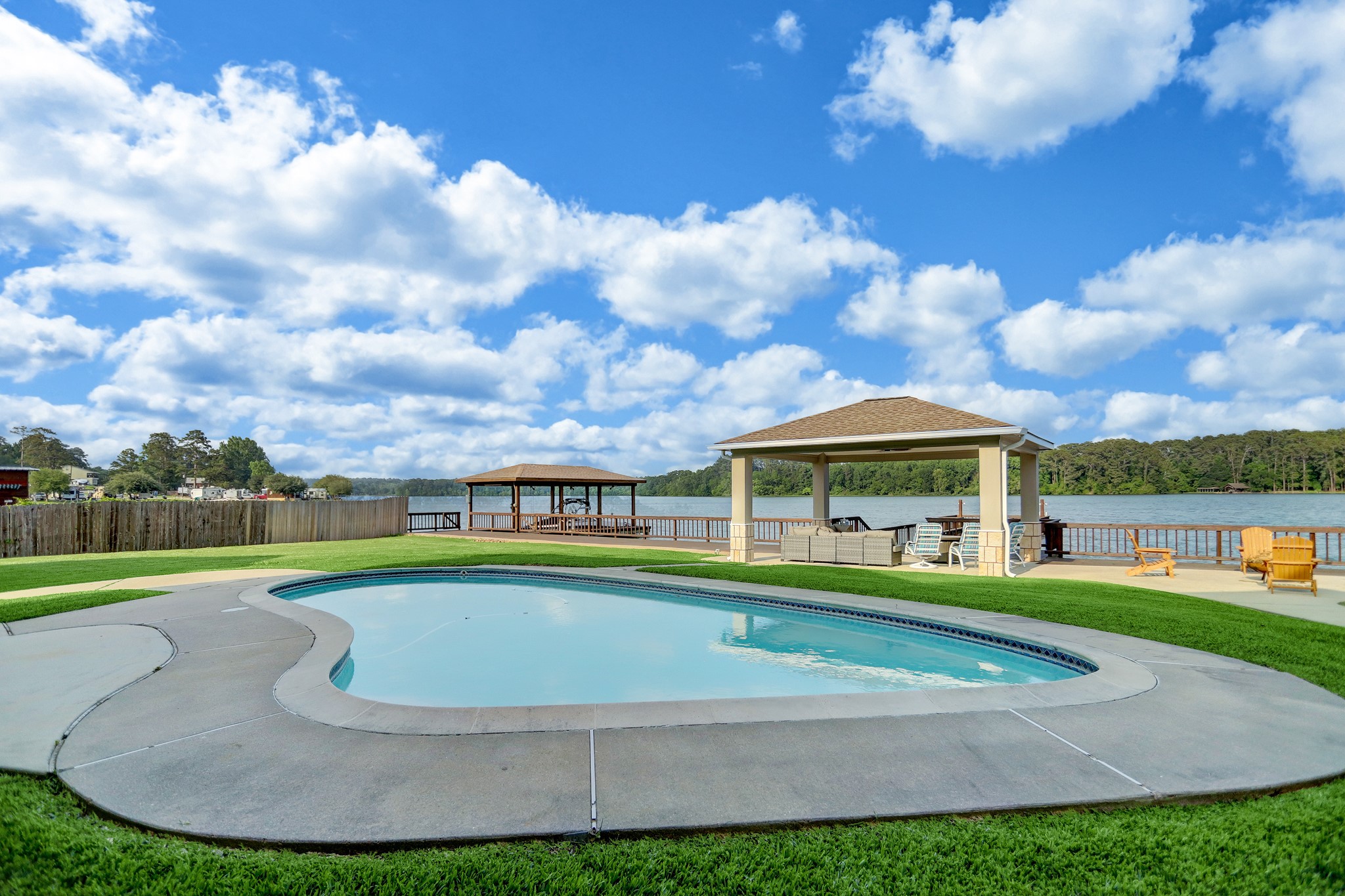14362 Calvary Road Willis, TX 77318 - Photo 29 of 44 a view of a white house with a big yard and potted plants