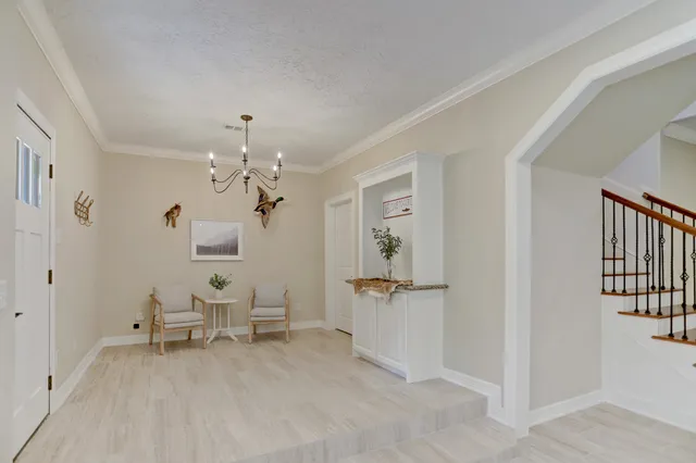 a living room with furniture and a table