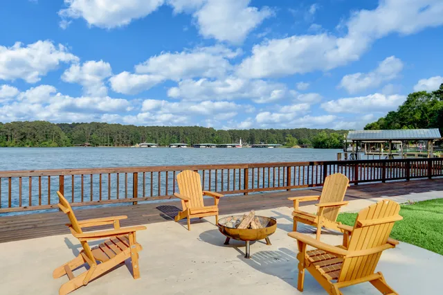 a view of a patio with couches chairs dining table and chairs