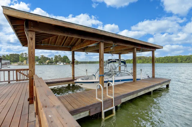 a front view of a house with a yard table and chairs
