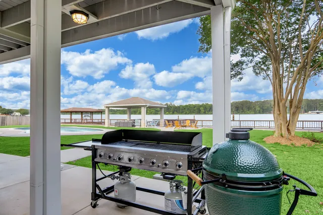 a bedroom with a bed and glass door