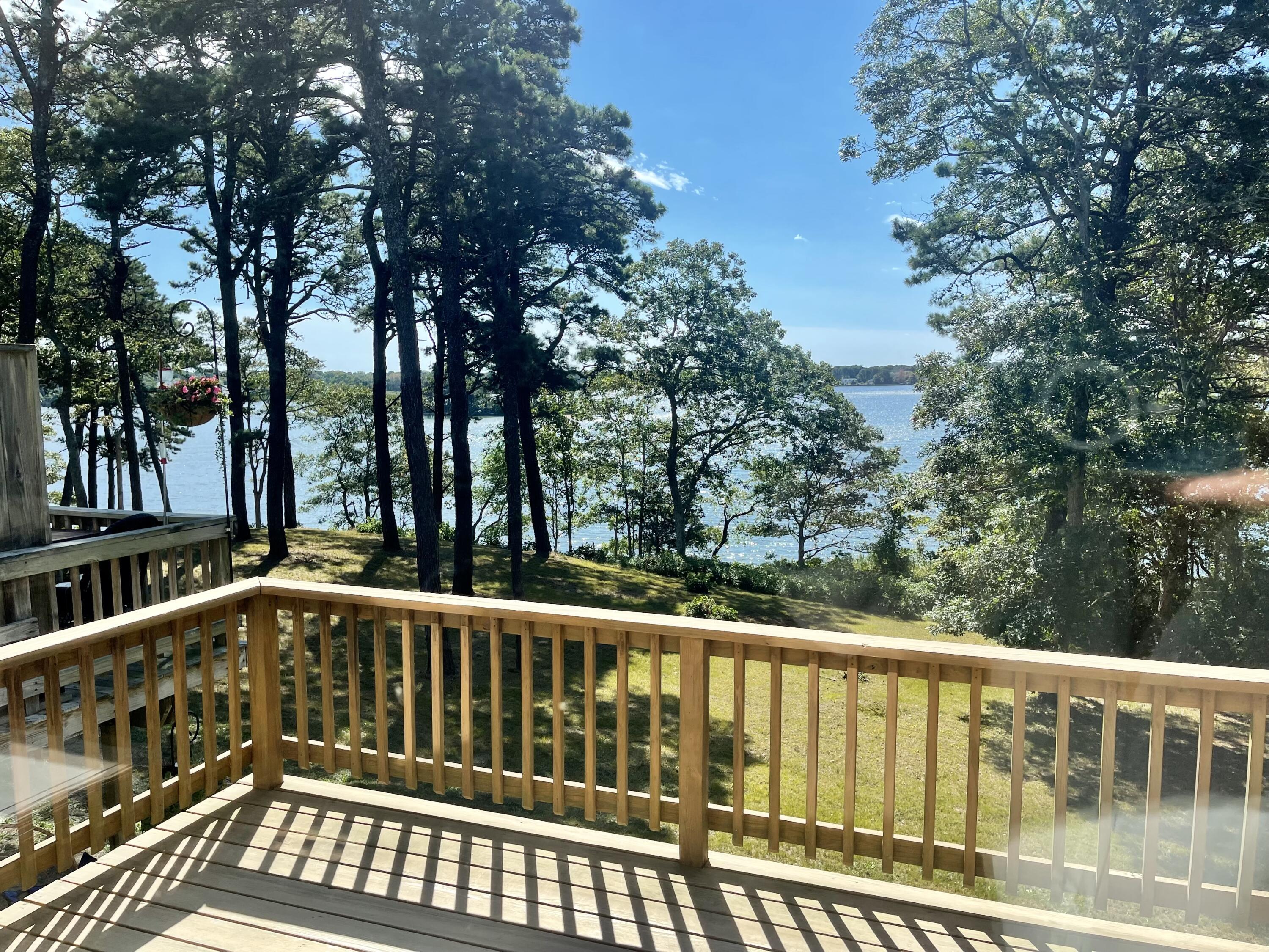 1 Calico Circle, Unit 1 Dennis, MA 02639 - Photo 12 of 52 a view of balcony with deck and trees