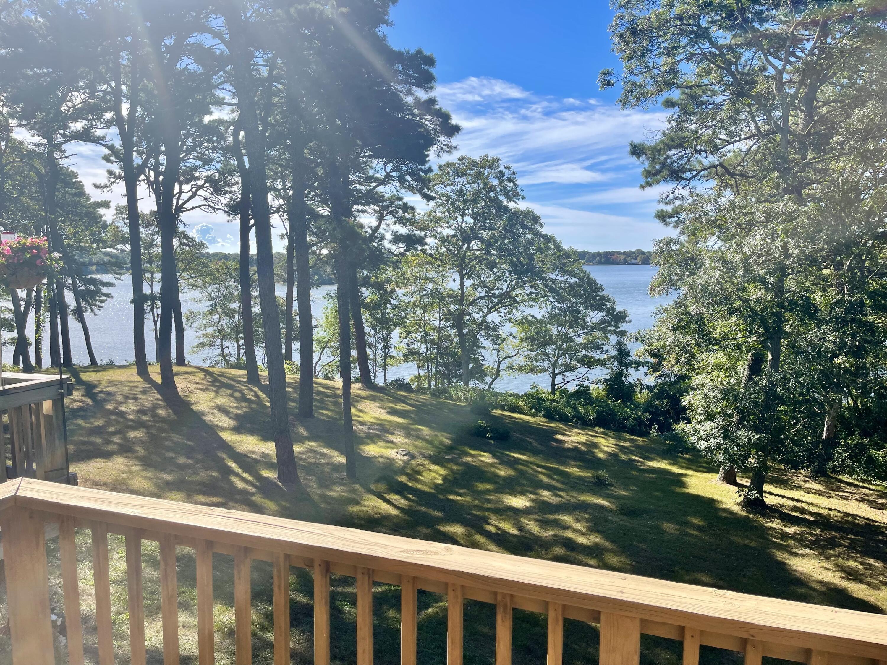 1 Calico Circle, Unit 1 Dennis, MA 02639 - Photo 13 of 52 a view of a yard from a balcony