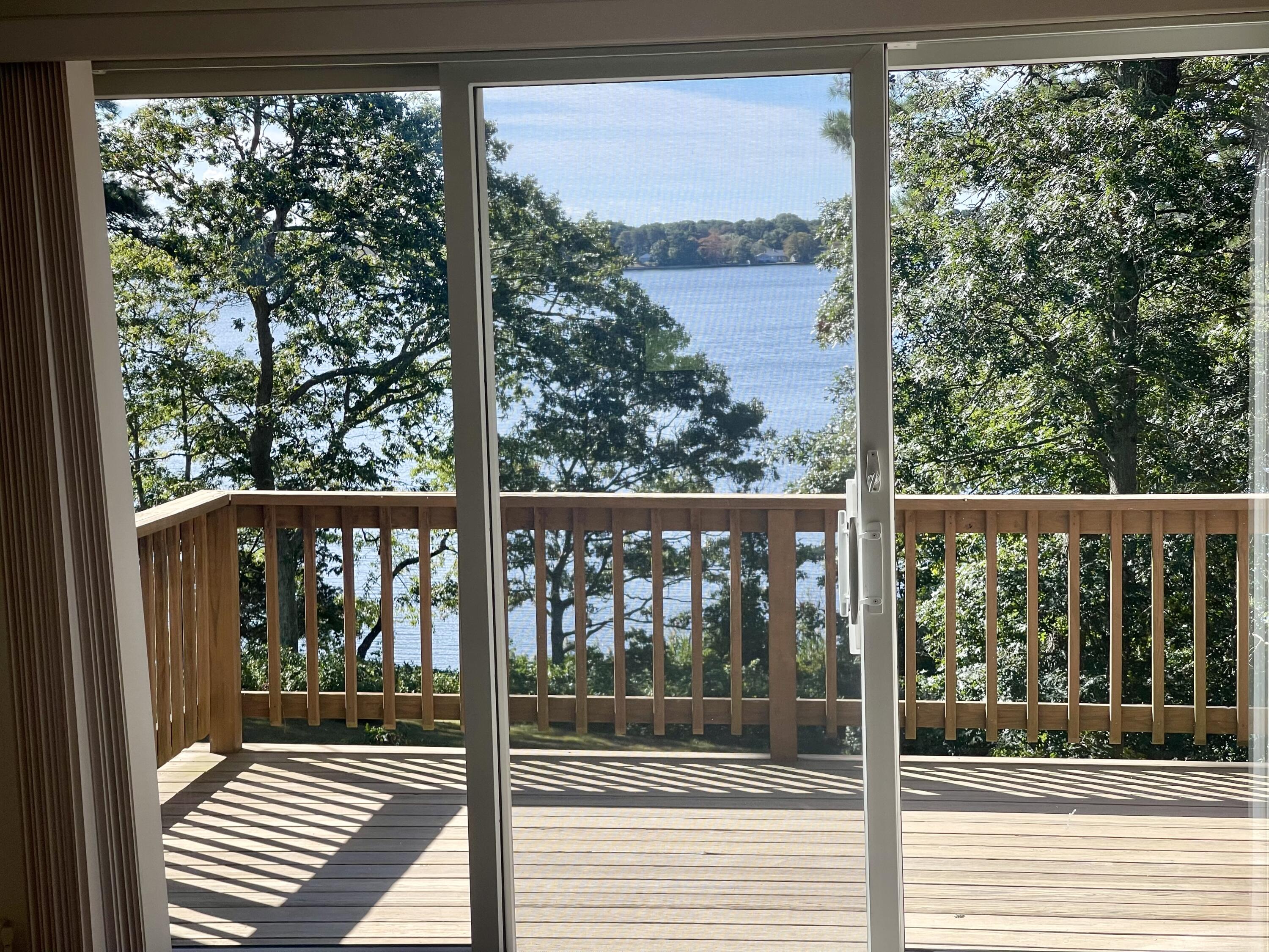 1 Calico Circle, Unit 1 Dennis, MA 02639 - Photo 15 of 52 a view of a street from a balcony