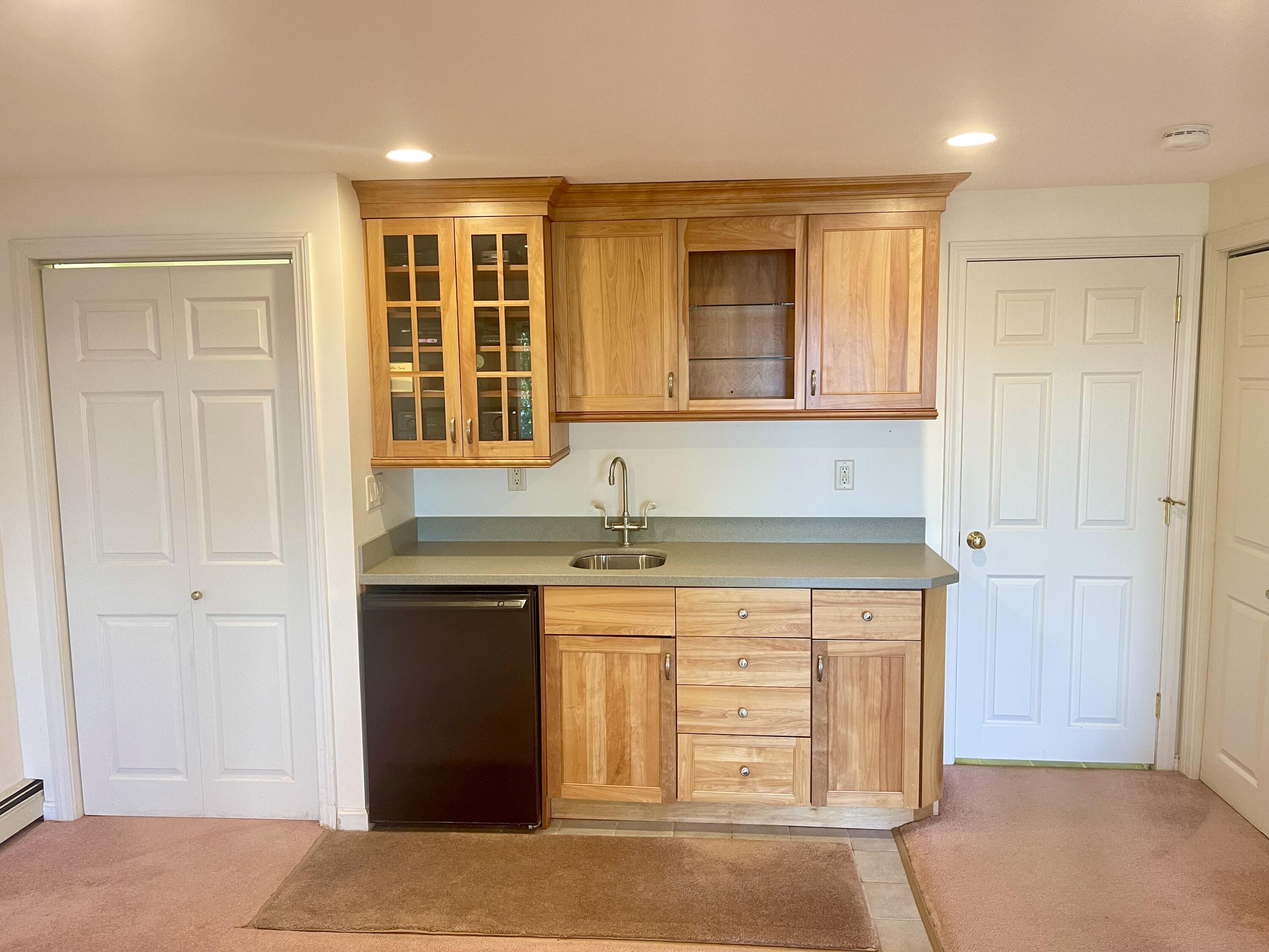 1 Calico Circle, Unit 1 Dennis, MA 02639 - Photo 26 of 52 a kitchen with a sink cabinets and a window