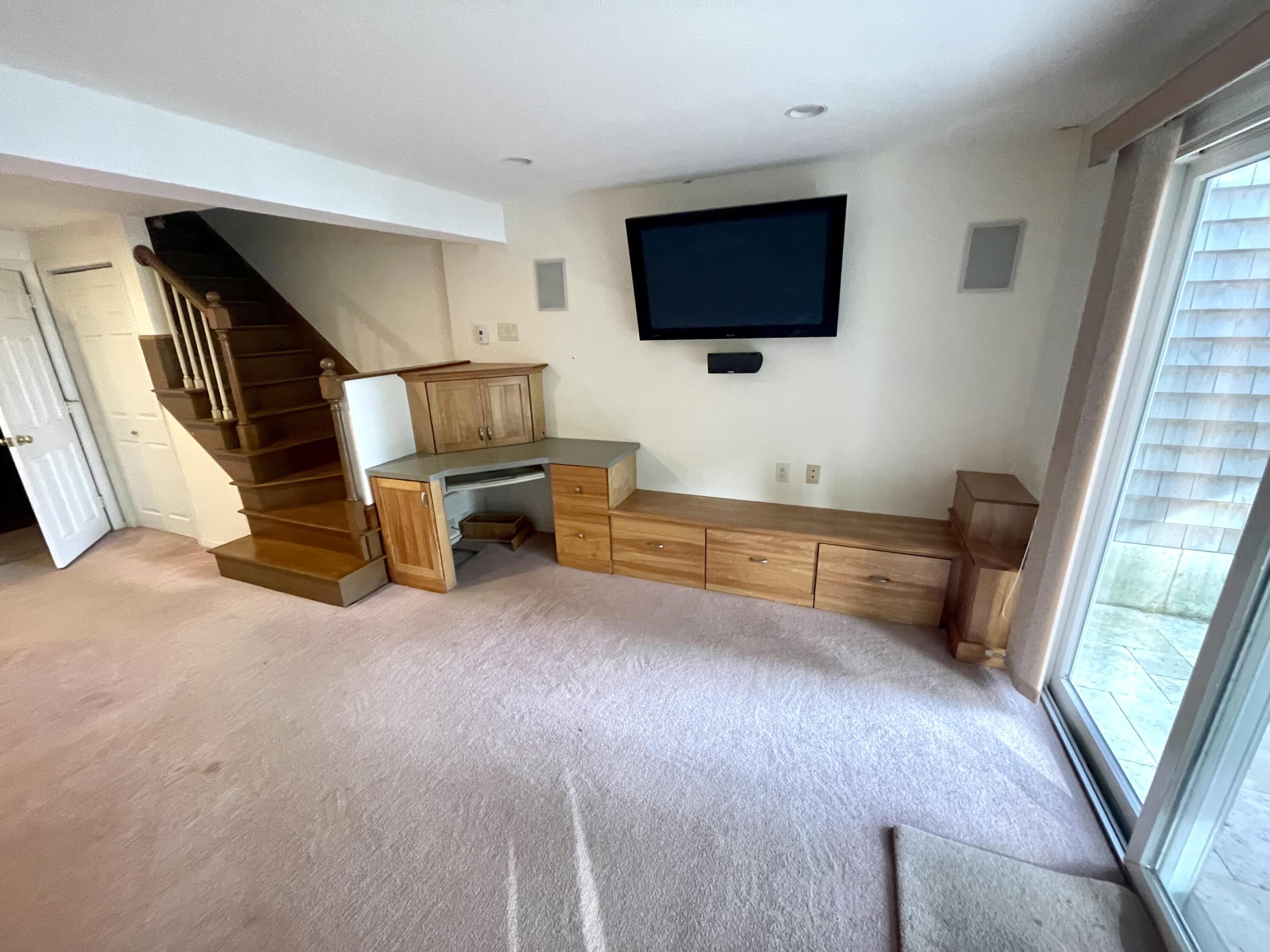1 Calico Circle, Unit 1 Dennis, MA 02639 - Photo 28 of 52 a living room with furniture and a flat screen tv