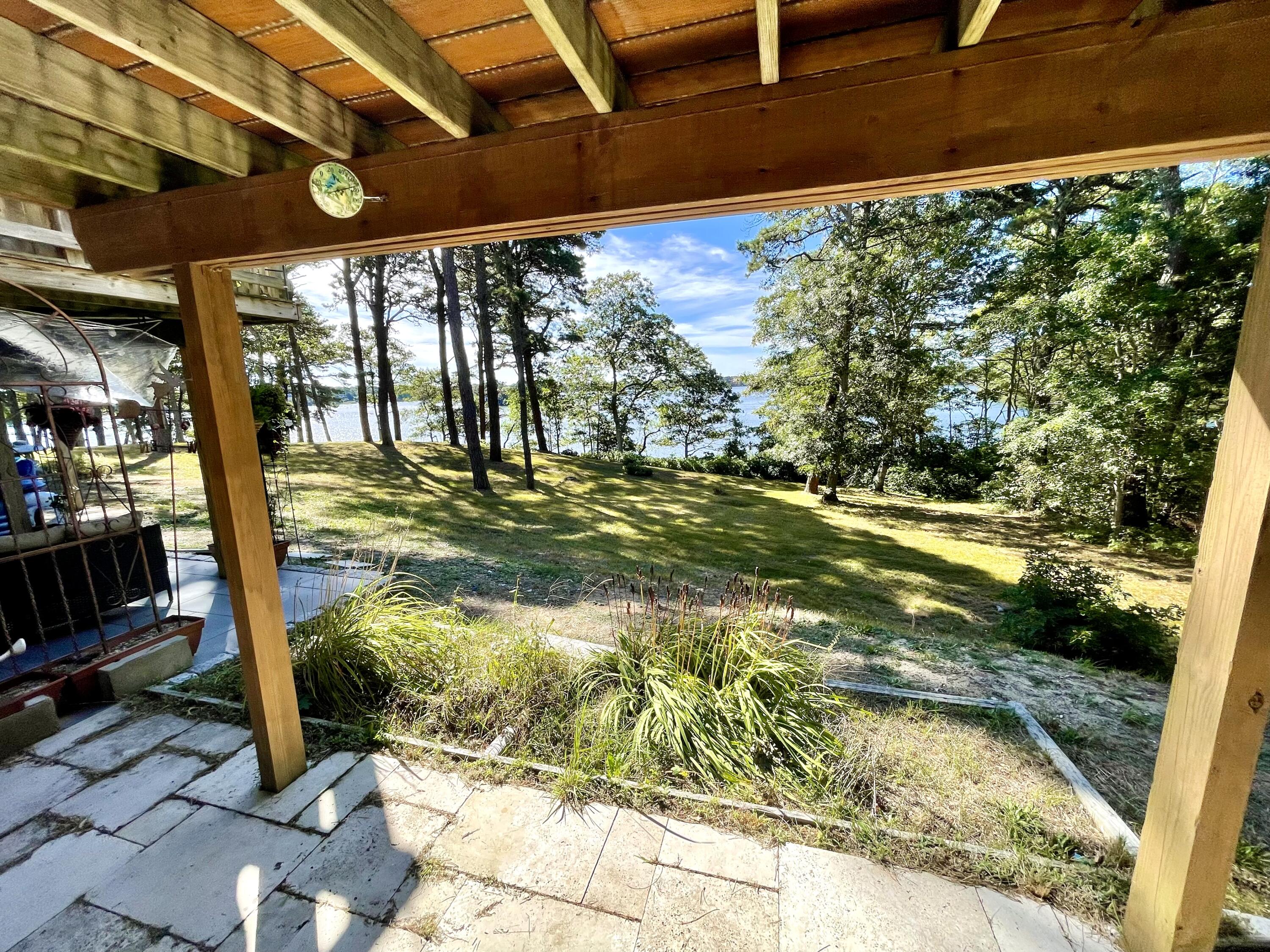 1 Calico Circle, Unit 1 Dennis, MA 02639 - Photo 30 of 52 a view of a swimming pool with a patio