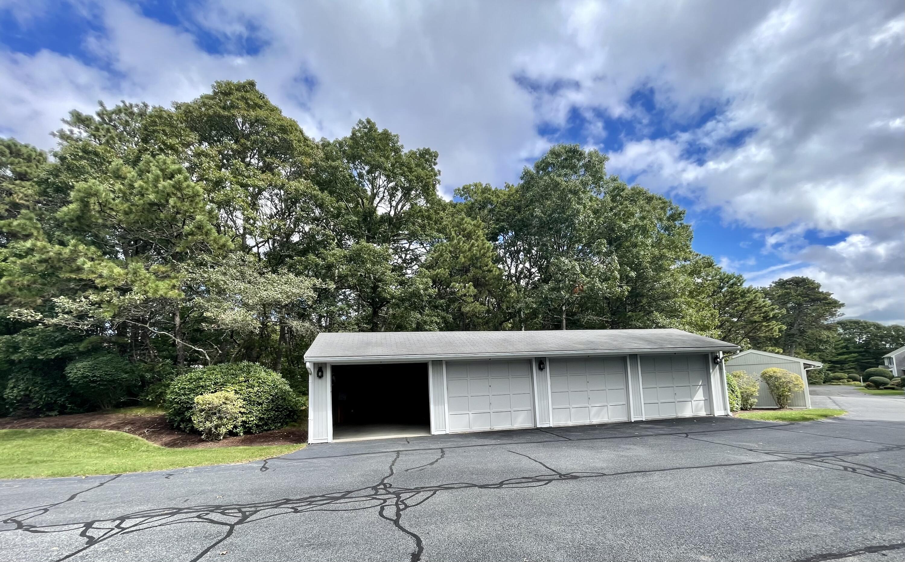 1 Calico Circle, Unit 1 Dennis, MA 02639 - Photo 31 of 52 a house with trees in front of it