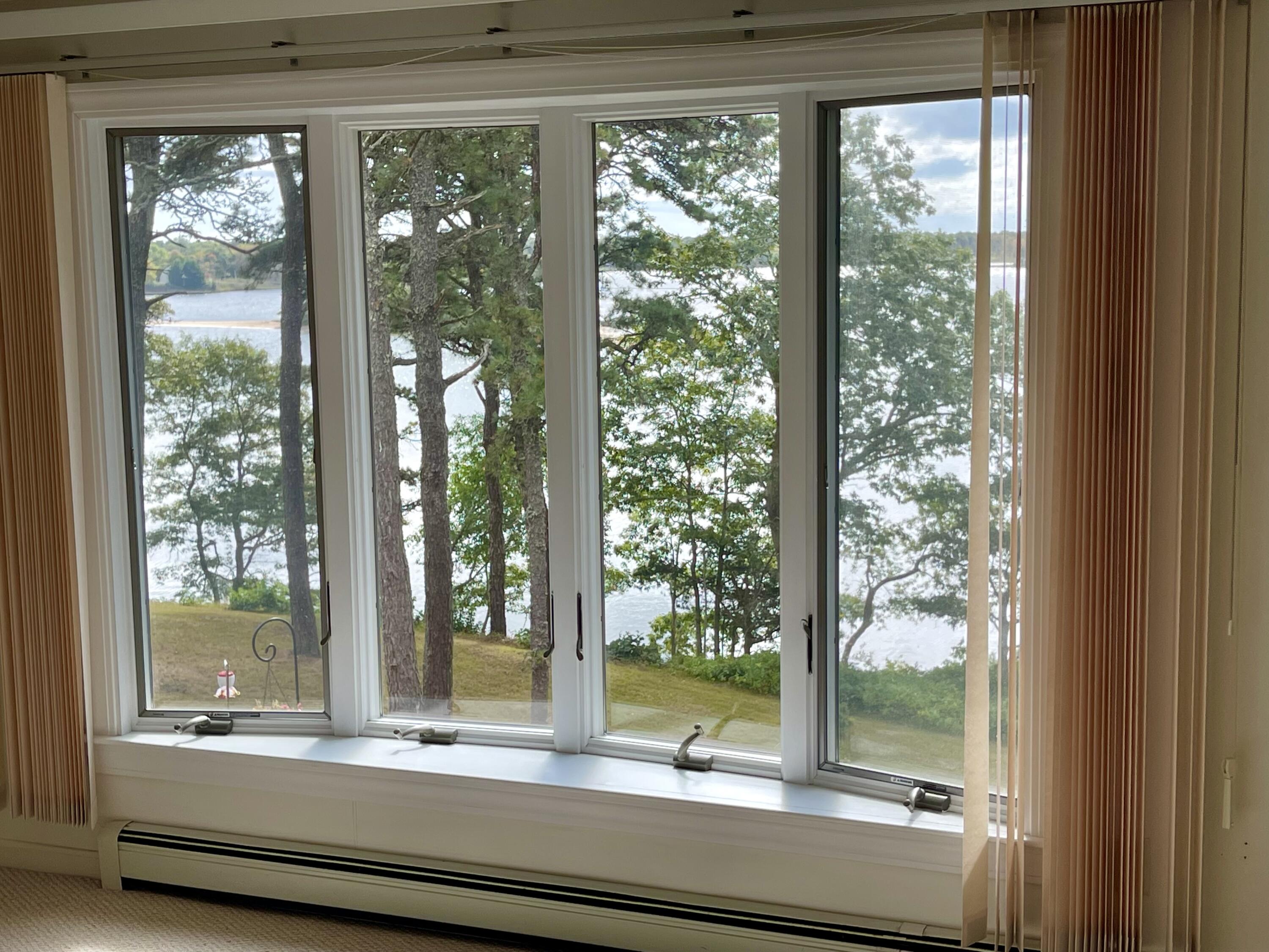 1 Calico Circle, Unit 1 Dennis, MA 02639 - Photo 36 of 52 a view of room with a large window and wooden floor
