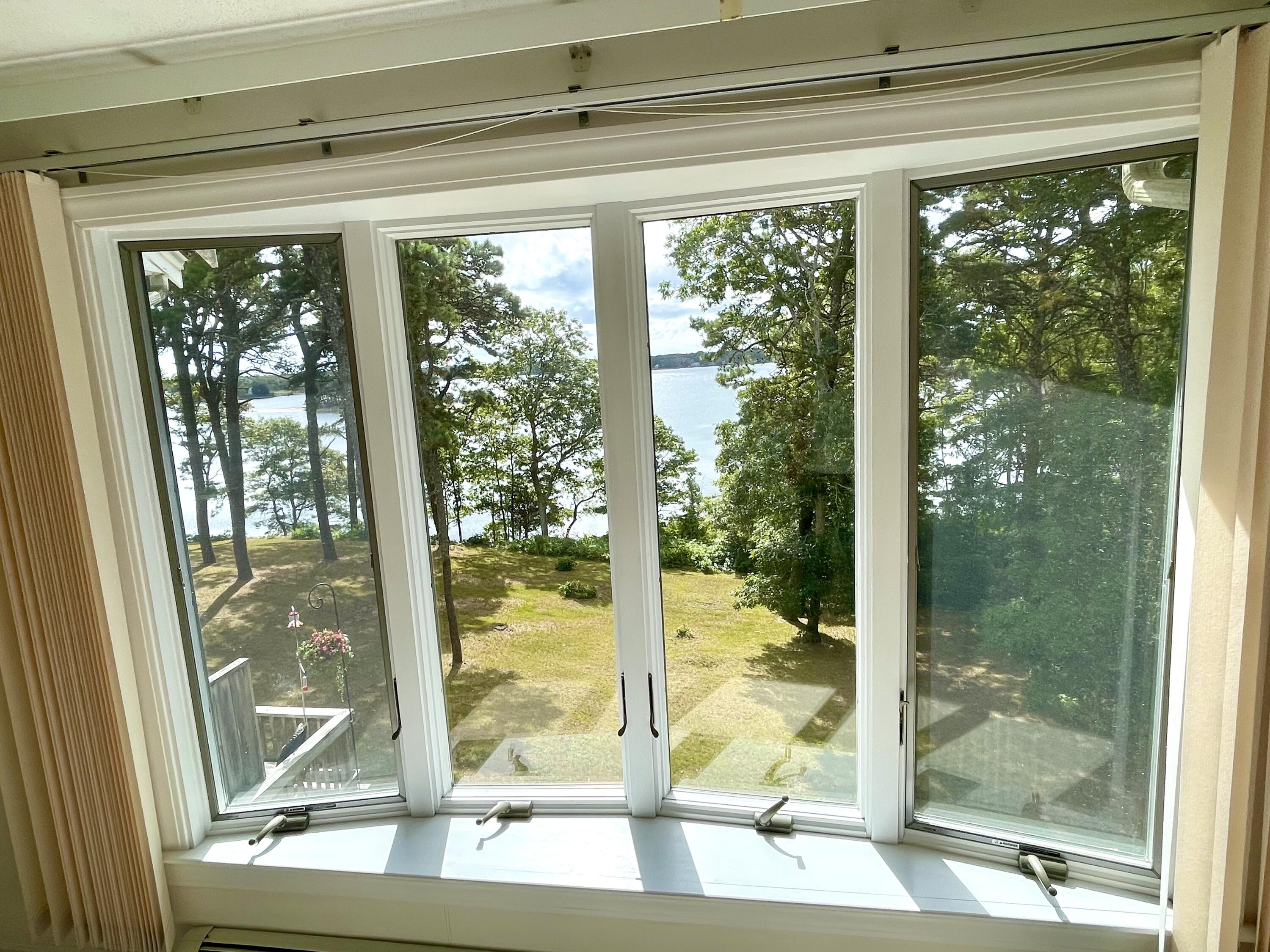 1 Calico Circle, Unit 1 Dennis, MA 02639 - Photo 37 of 52 a view of a glass door and wooden floor