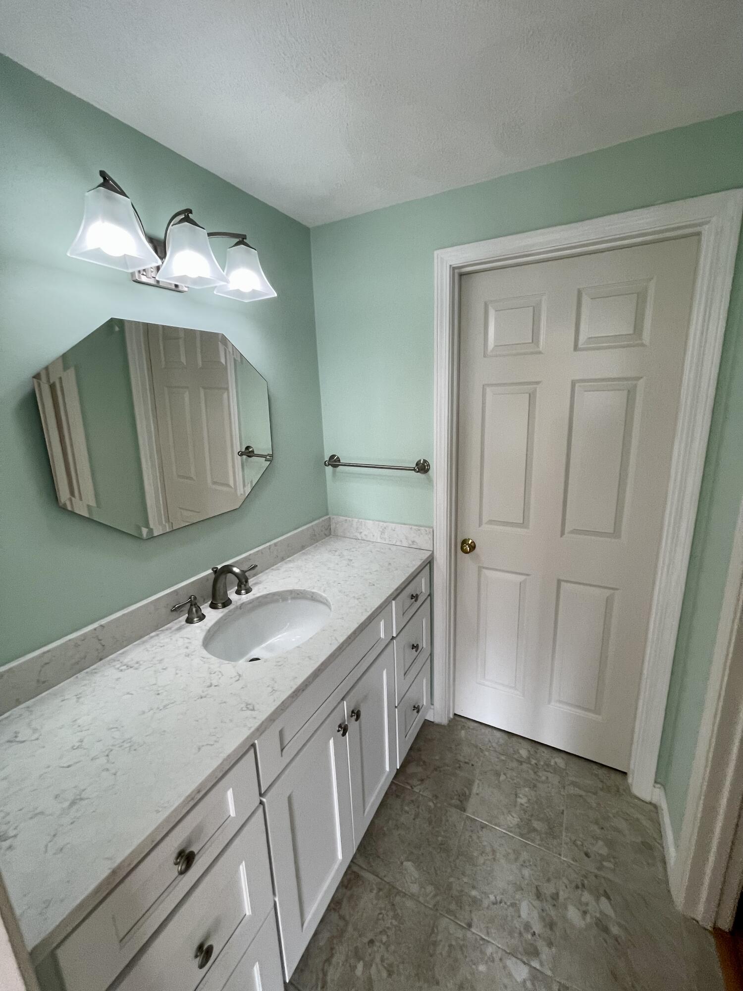 1 Calico Circle, Unit 1 Dennis, MA 02639 - Photo 41 of 52 a bathroom with a sink and a mirror