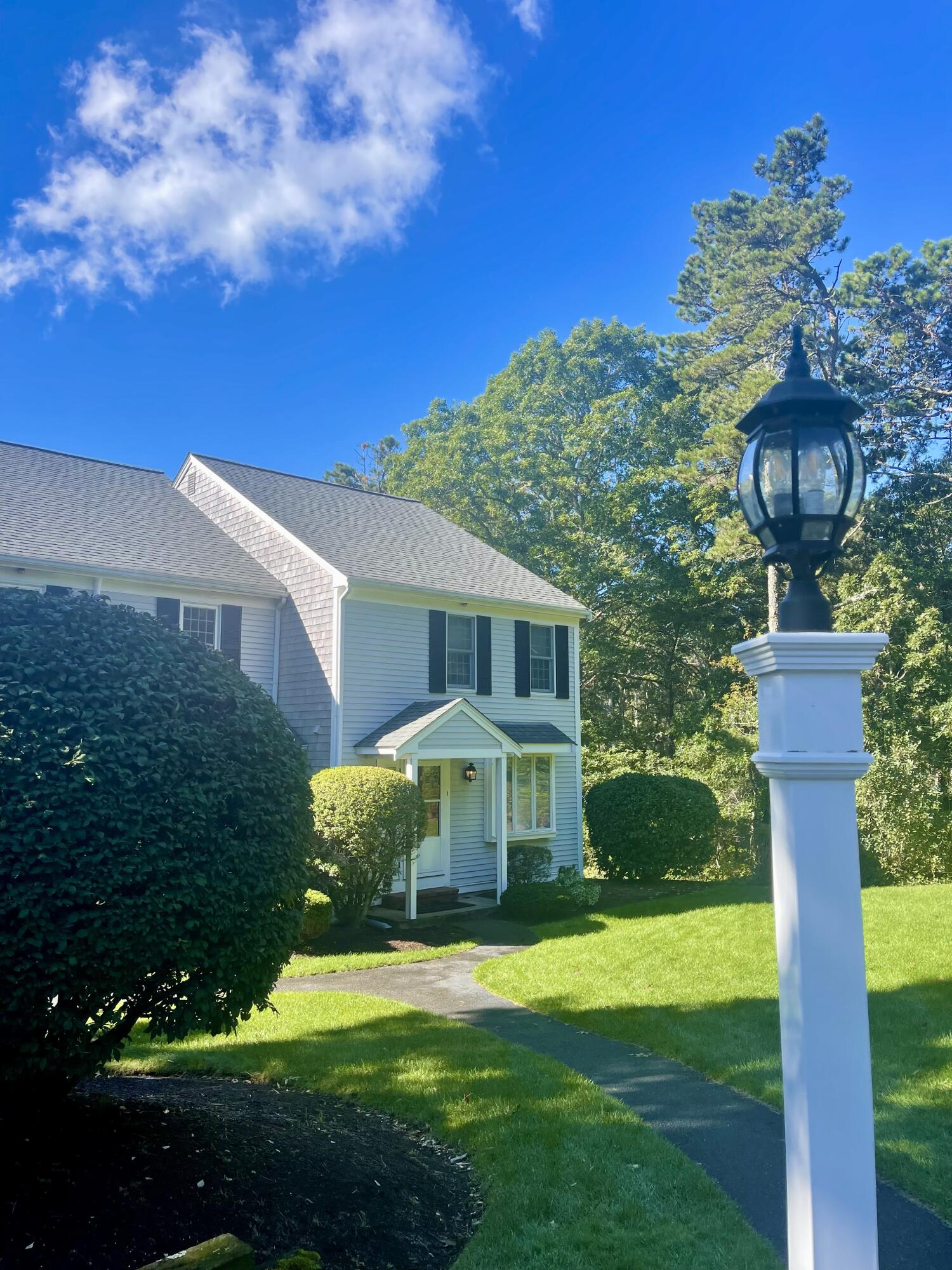 1 Calico Circle, Unit 1 Dennis, MA 02639 - Photo 49 of 52 a front view of a house with garden