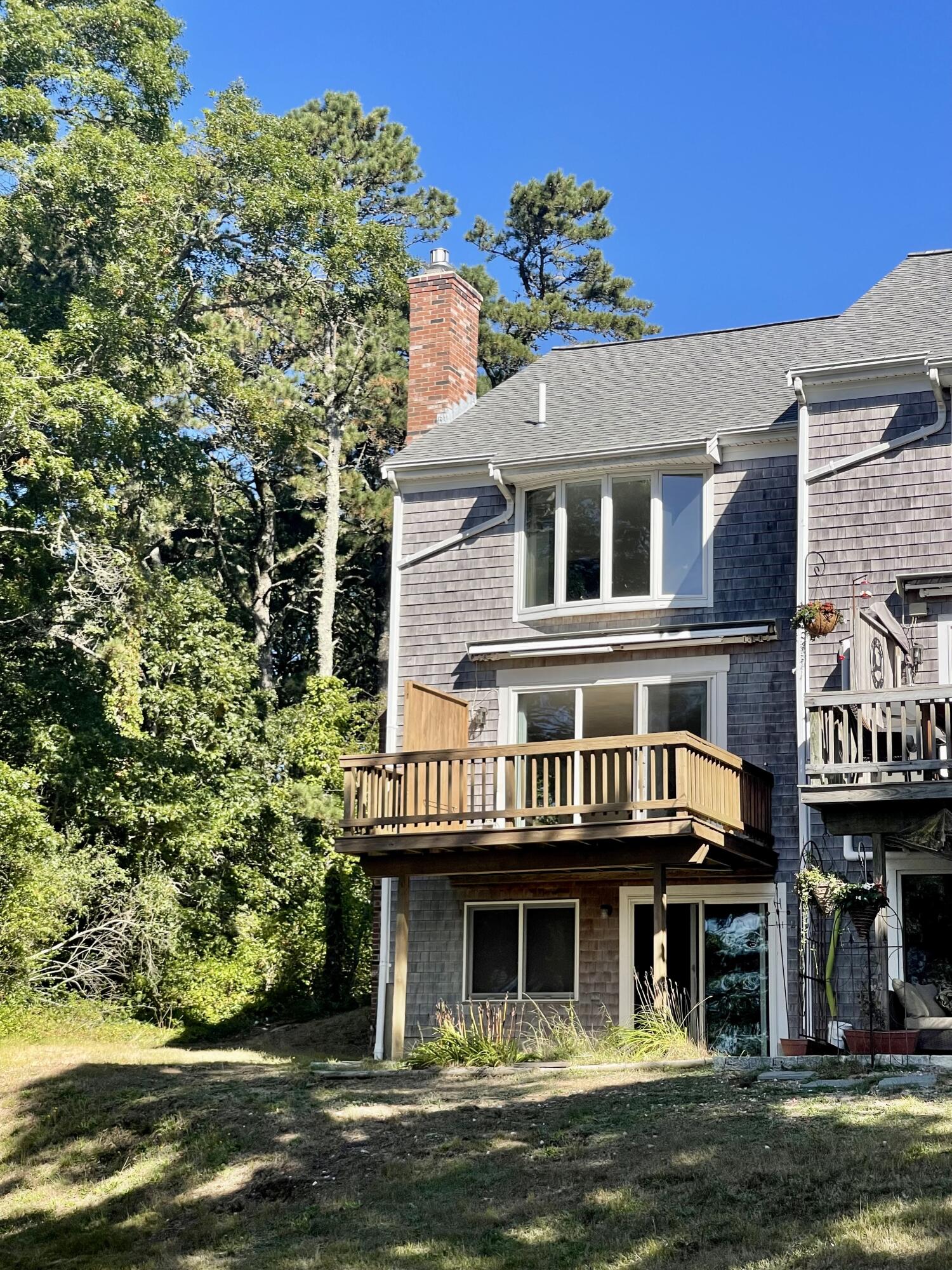 1 Calico Circle, Unit 1 Dennis, MA 02639 - Photo 50 of 52 a front view of a house with a yard