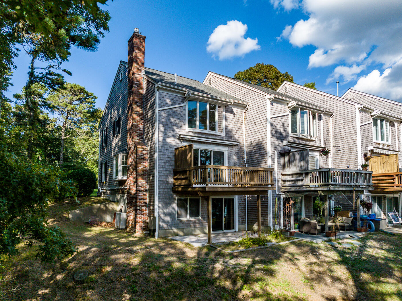 1 Calico Circle, Unit 1 Dennis, MA 02639 - Photo 5 of 52 a front view of a building with street view