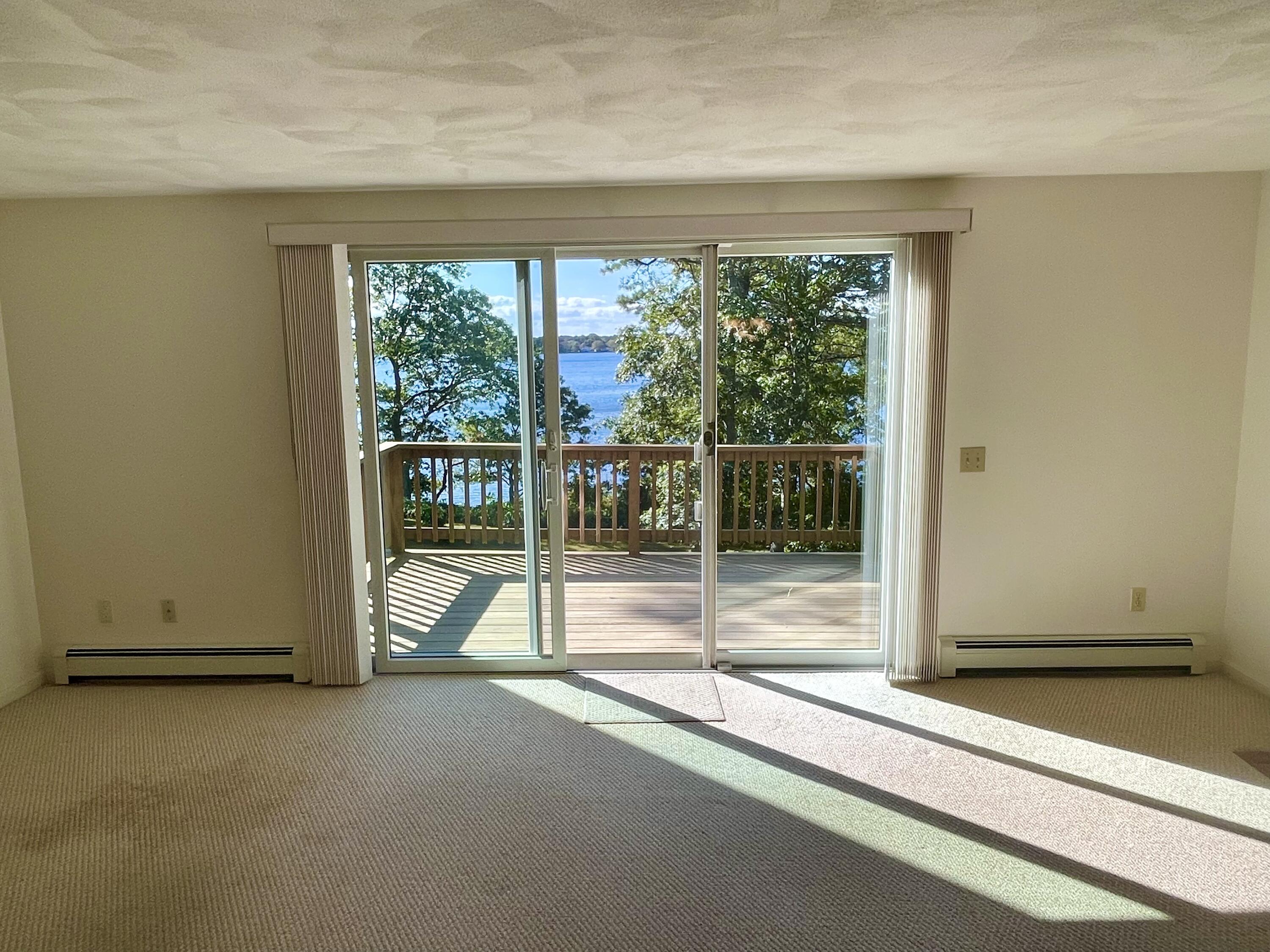 1 Calico Circle, Unit 1 Dennis, MA 02639 - Photo 52 of 52 a view of empty room with floor to ceiling window