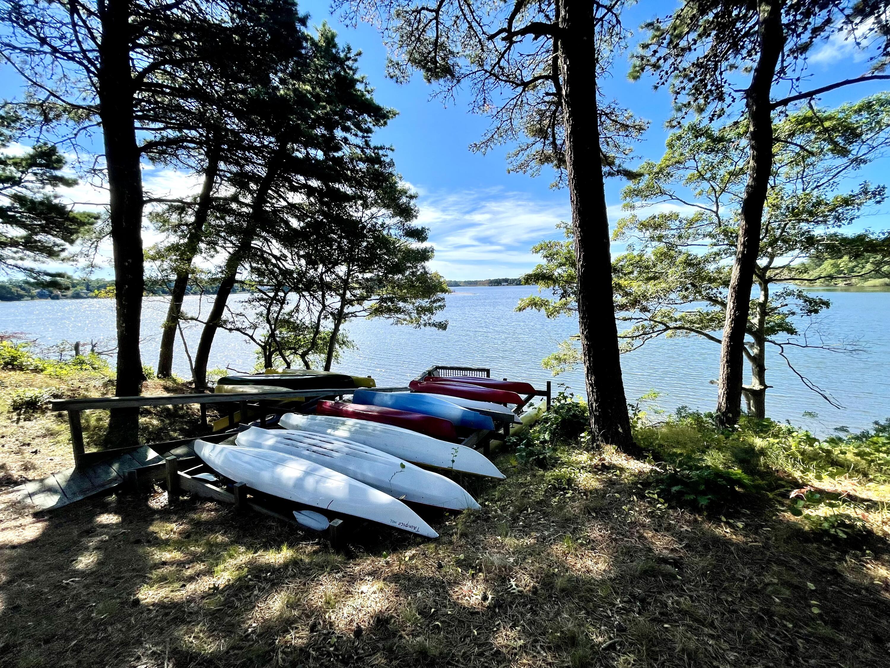 1 Calico Circle, Unit 1 Dennis, MA 02639 - Photo 8 of 52 a view of a backyard with large trees