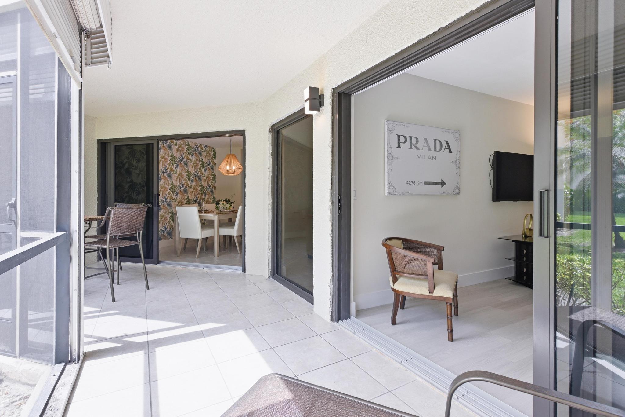 5800 Camino Del Sol, Unit 106 Boca Raton, FL 33433 - Photo 11 of 36 PATIO, IMPACT SLIDERS