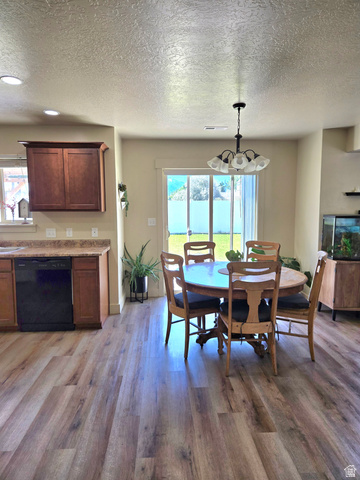 601 West 150 North, Unit 25 Springville, UT 84663 - Photo 8 of 29 Open-concept dining area featuring wood-finish flooring, recessed lighting, and a pendant light fixture