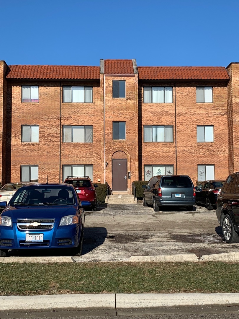 a view of a car parked in front of a house