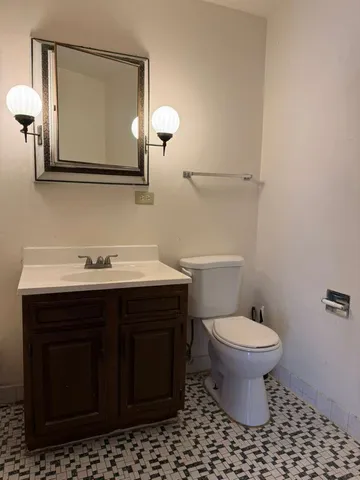 a bathroom with a sink and a toilet