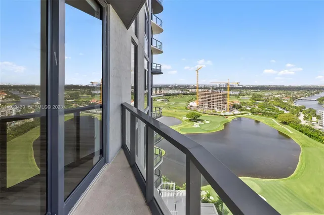 a view of a kitchen cabinets wooden floor and a refrigerator